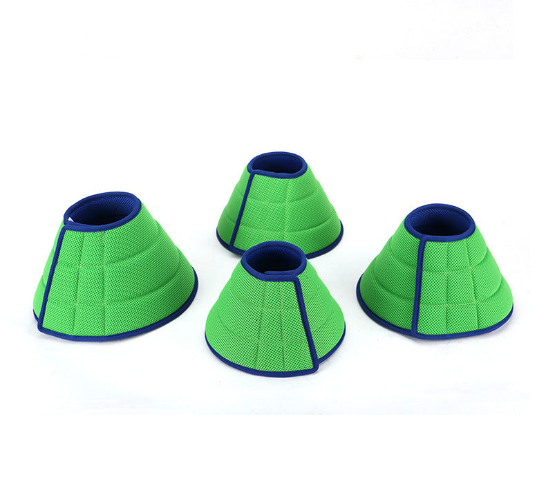 Set of four green soft pet recovery cones with blue edges for dogs and cats