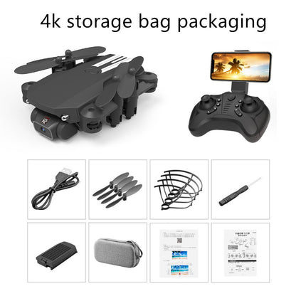Folded black mini folding drone with 4-axis design, remote controller with phone holder, and accessories