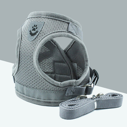 Grey breathable dog harness with reflective mesh and matching durable leash on white and grey background