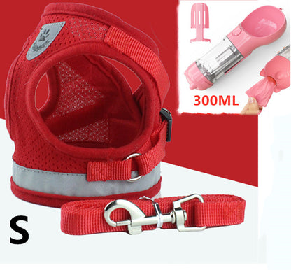 Small red breathable mesh dog harness with reflective strip and matching leash with metal hardware