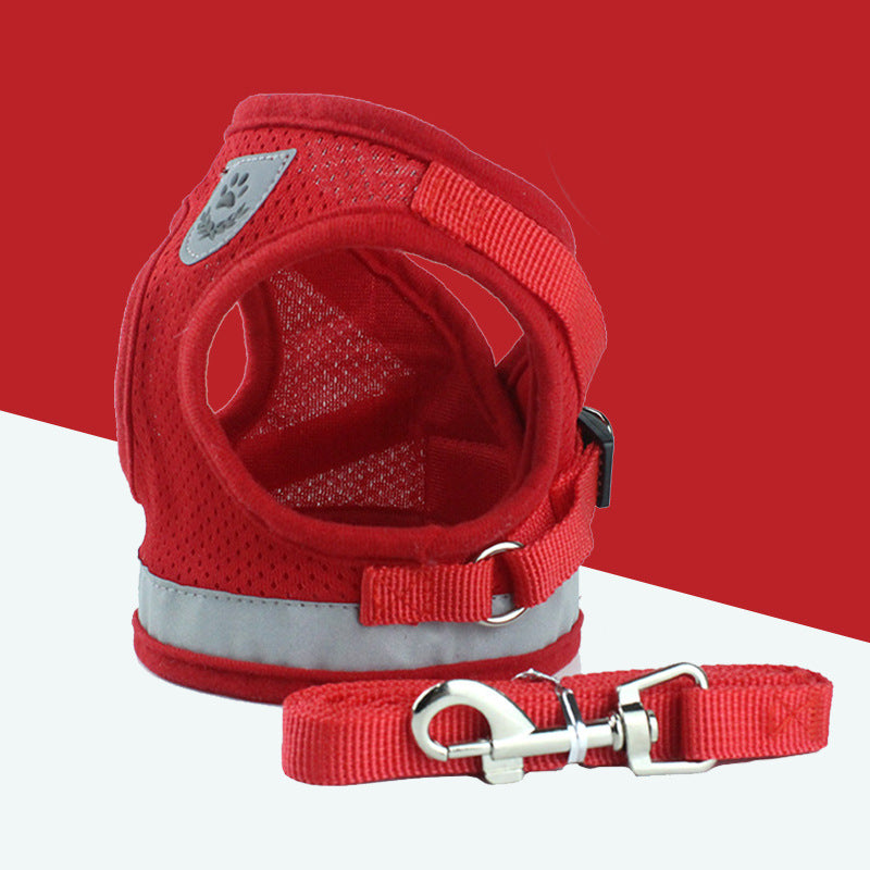 Red breathable dog harness with reflective strip and matching leash featuring metal hardware