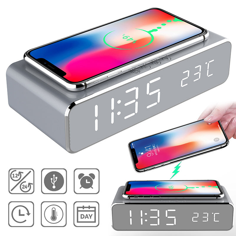 Grey LED digital alarm clock displaying 11:35 and 23°C with wireless phone charger and multi-alarm settings