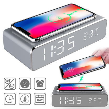 Grey LED digital alarm clock displaying 11:35 and 23°C with wireless phone charger and multi-alarm settings