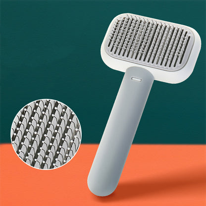Ergonomic grey pet grooming brush with close-up of fine metal bristles for cat and dog shedding