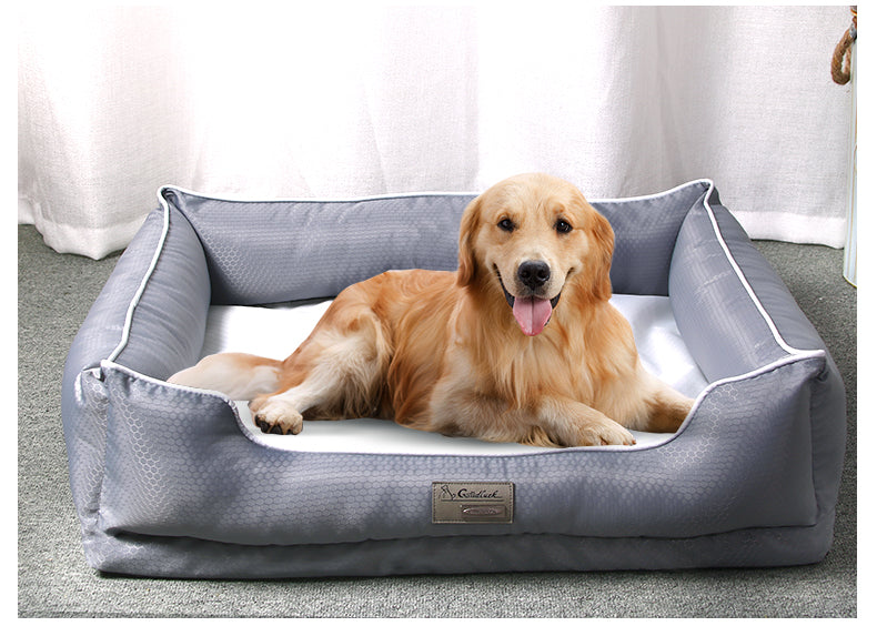 Golden retriever lying on a dark grey removable dog bed with machine washable cover