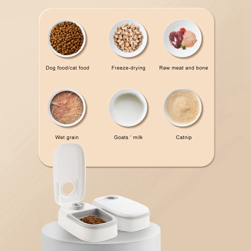 White automatic pet feeder with two compartments, one open showing dry pet food, with pet food types displayed above