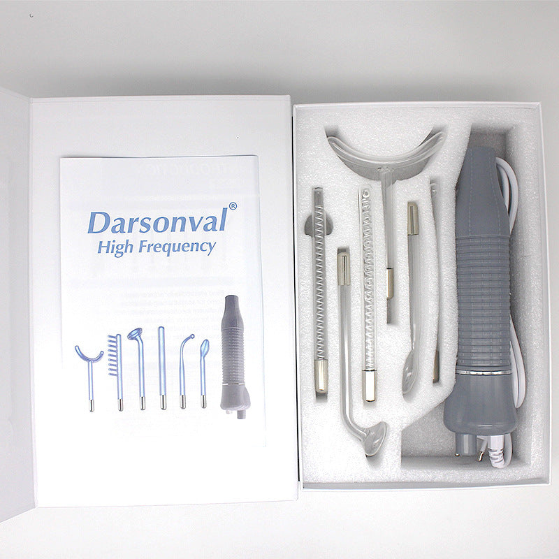 Darsonval high frequency electrotherapy device with interchangeable glass electrodes in white foam packaging
