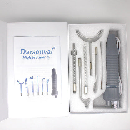 Darsonval high frequency electrotherapy device with interchangeable glass electrodes in white foam packaging