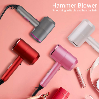 Four Hammer Blower hair dryers in grey, white, red, and pink on a pink background with cosmetics