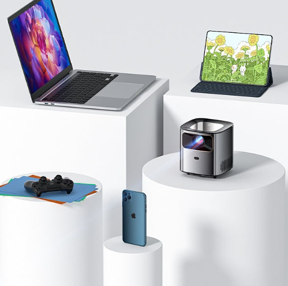 Compact 1080p mini portable projector with 5G WiFi displayed with laptop, tablet, smartphone, and game controller