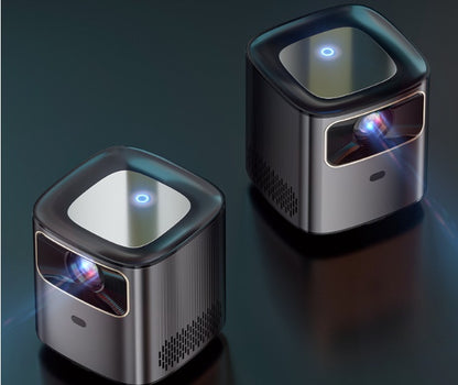 Two compact black mini portable projectors with 1080p HD resolution and glowing power indicators