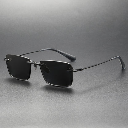 Black and gray rectangular polarized sunglasses with thin metal frame on gray surface