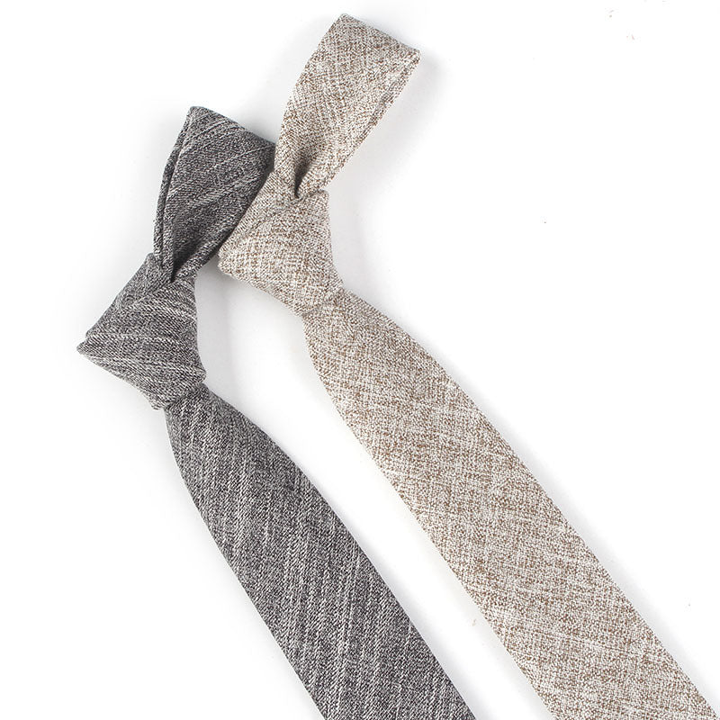 Two narrow cotton ties with slim textured weave in gray and beige, styled for business and casual wear