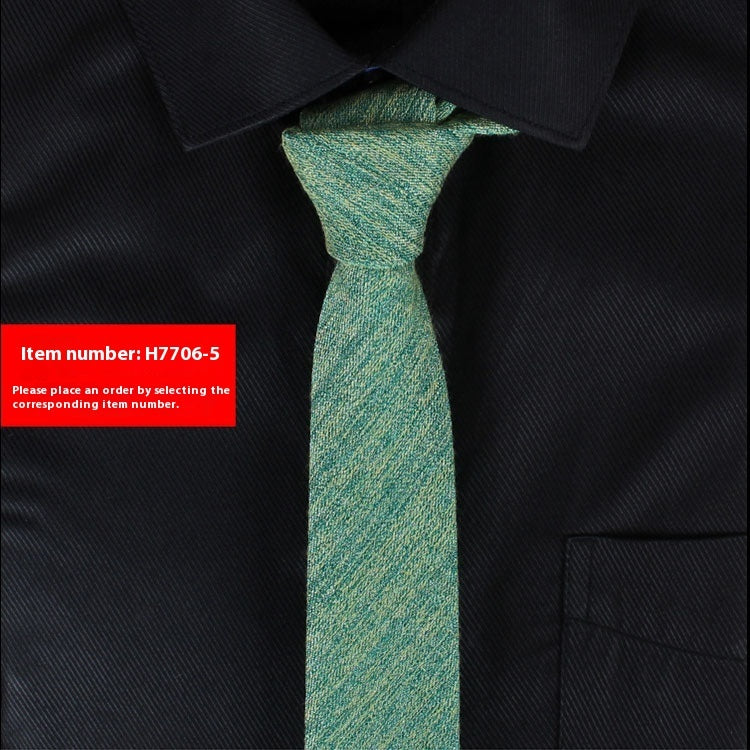 Green narrow cotton slim tie worn with black dress shirt for business casual and weddings