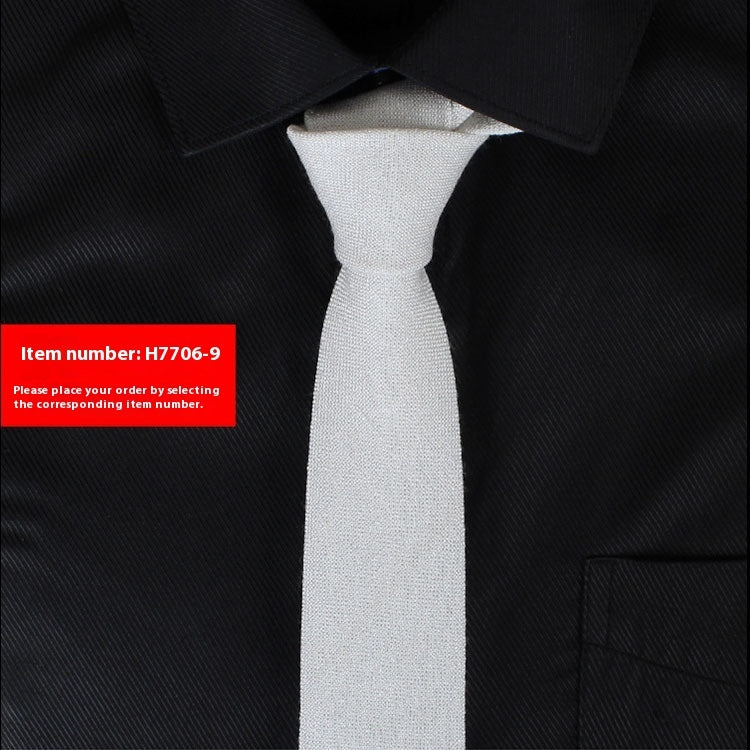 Slim white cotton tie on black dress shirt for business casual and wedding styles