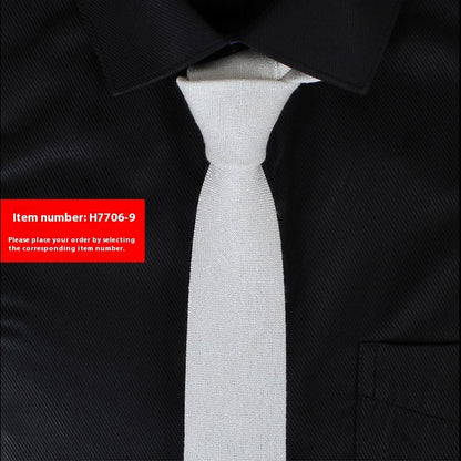 Slim white cotton tie on black dress shirt for business casual and wedding styles