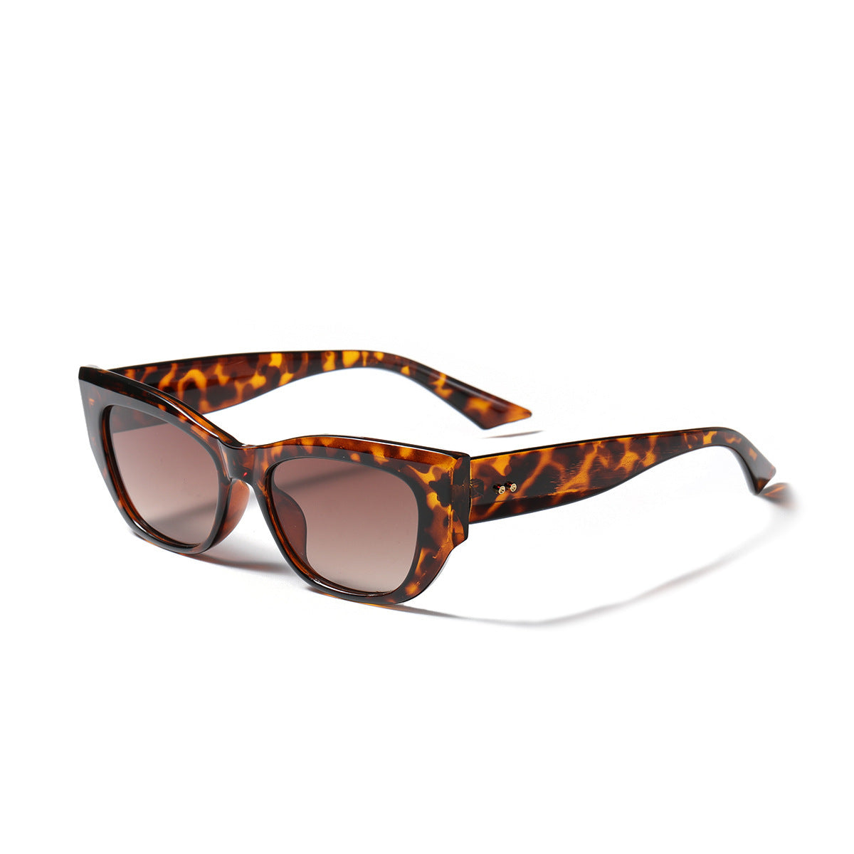 Retro British style sunglasses with tortoiseshell frames and brown tinted lenses on white background