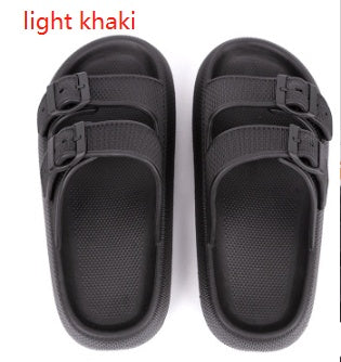 Pair of black thick-soled EVA sandals with adjustable double straps on white background