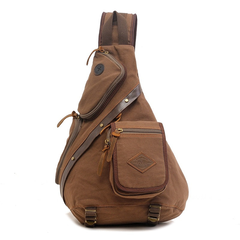 Khaki canvas messenger sling bag with multiple zippered pockets and brown leather accents