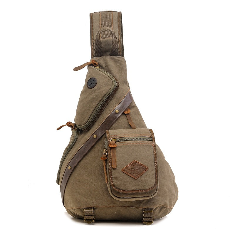 Khaki canvas messenger sling bag with multiple zippered pockets and leather accents