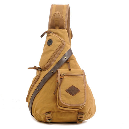Khaki canvas sling messenger bag with multiple zippered pockets and leather accents