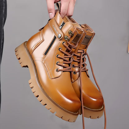 Light brown men's leather Martin boots with thick sole, zipper, and lace-up design held by hand