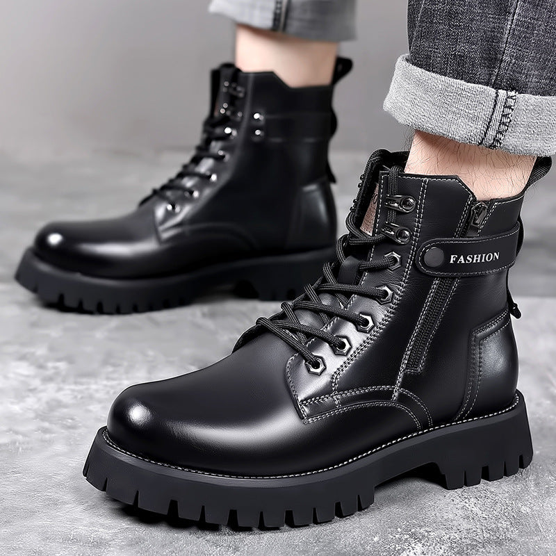 Close-up of men's black leather combat boots with thick lug soles and 'FASHION' strap detail