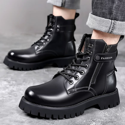 Close-up of men's black leather combat boots with thick lug soles and 'FASHION' strap detail