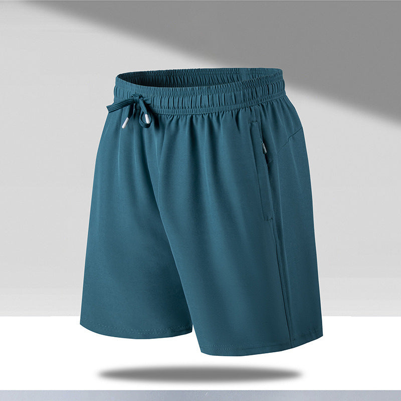 Men's teal quick-dry beach shorts with elastic waistband and drawstrings, lightweight fabric