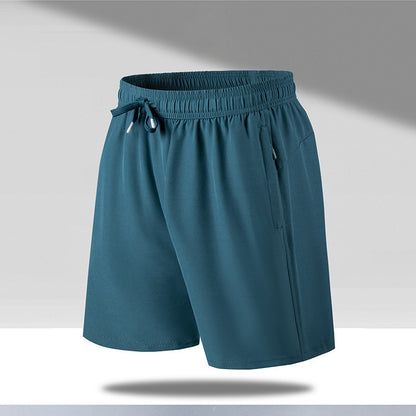 Men's teal quick-dry beach shorts with elastic waistband and drawstrings, lightweight fabric