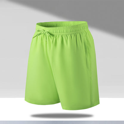 Neon green men's quick dry beach shorts with elastic waistband and drawstring