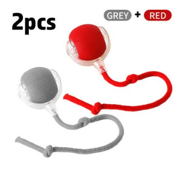 Two interactive cat toy balls with textured surfaces in grey and red, each attached to a matching knotted rope