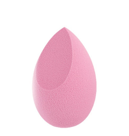 Pink makeup sponge beauty blender with teardrop shape and flat edge on white background