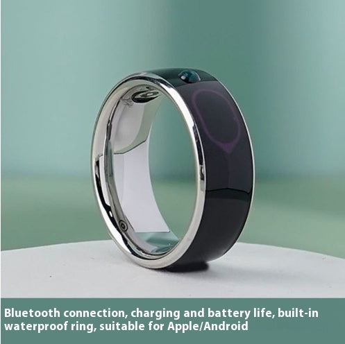 Sleek smart Bluetooth ring with metallic edges on smooth surface, designed for Apple and Android