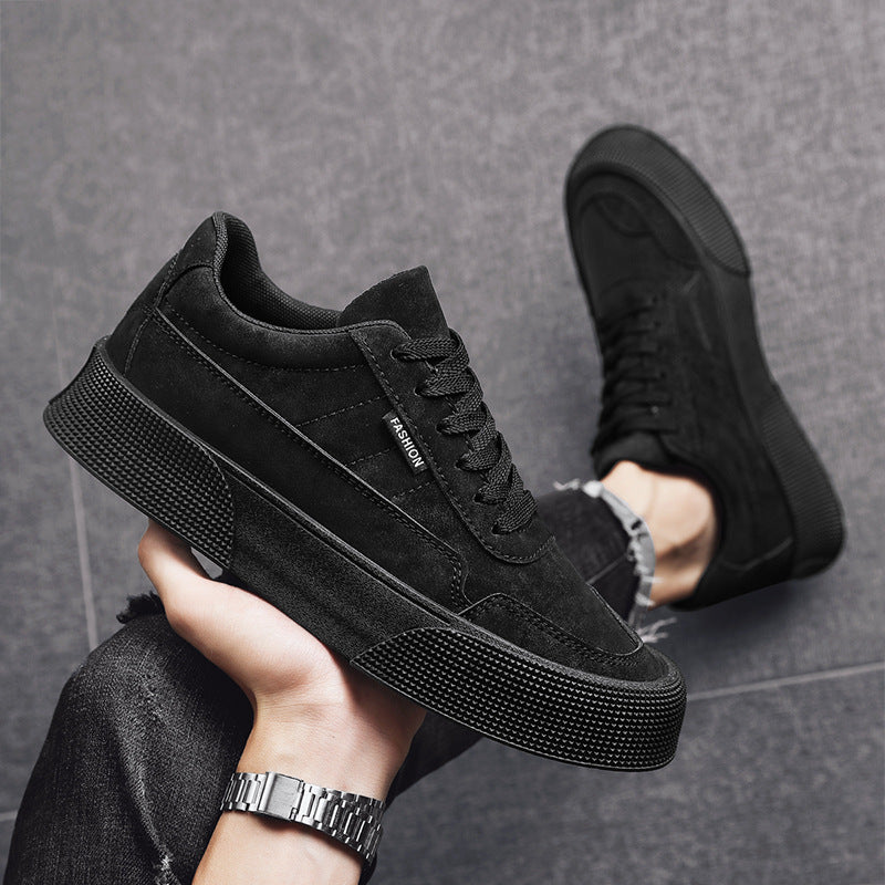 Black casual men's sneakers with thick textured sole and lace-up design