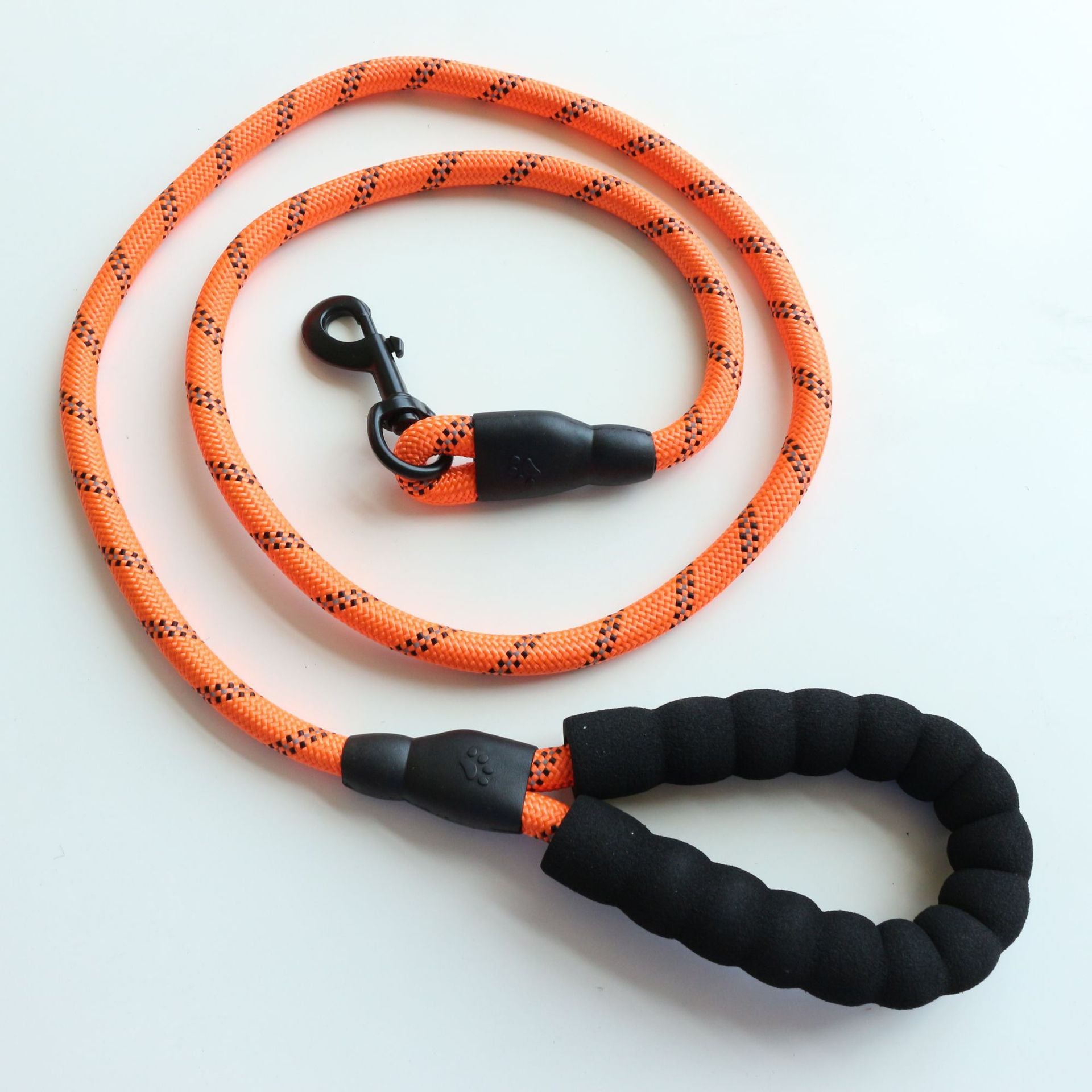 Orange reflective nylon dog leash with black foam handle and metal clip for safe walking