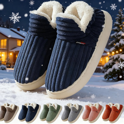 Blue cozy plush slippers with white fleece lining on snow with winter house background