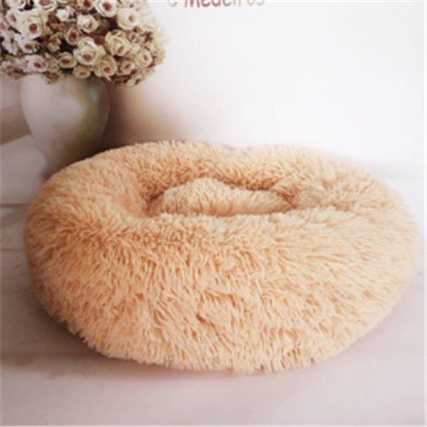 Soft plush pet bed in light beige, round cozy cushion perfect for cats and dogs