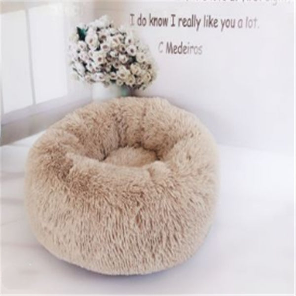 Beige plush round pet bed with soft faux fur cushion, cozy nest for cats and dogs