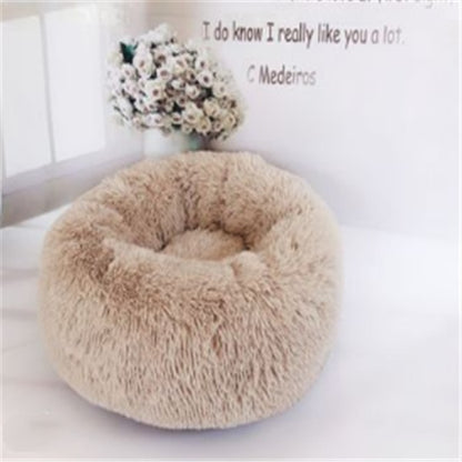 Beige plush round pet bed with soft faux fur cushion, cozy nest for cats and dogs