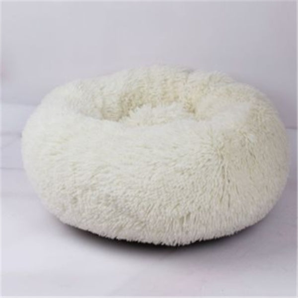 White plush round pet bed with soft shaggy texture, cozy nest for cats and dogs