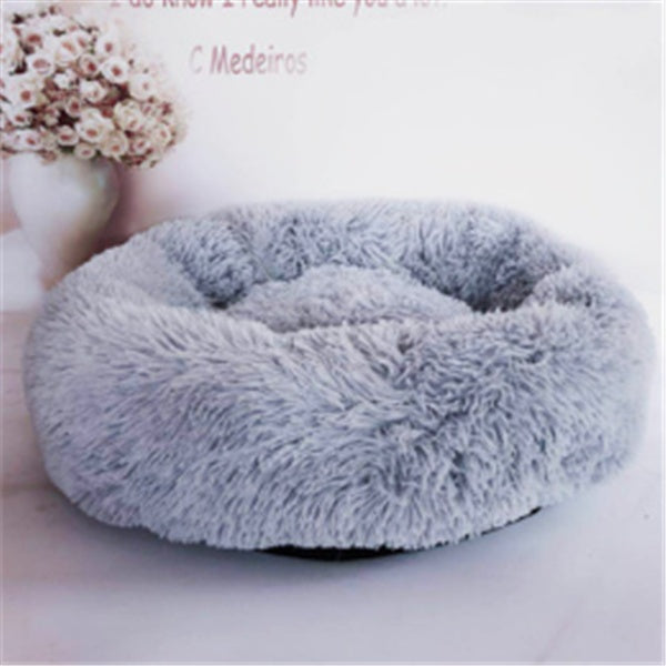 Round gray plush pet bed with soft fluffy cushion, cozy nest for cats and dogs