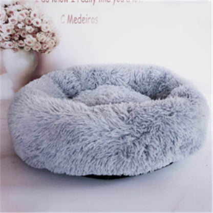 Round gray plush pet bed with soft fluffy cushion, cozy nest for cats and dogs