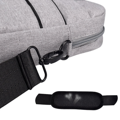 Close-up of gray fabric laptop shoulder bag with black detachable strap and metal clasp