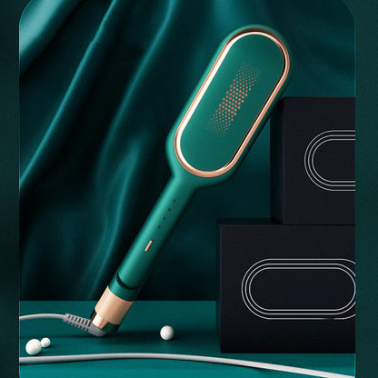 modern green and gold electric hair straightening brush on teal fabric with black boxes