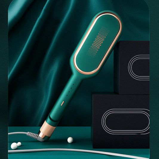modern green and gold electric hair straightening brush on teal fabric with black boxes