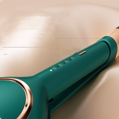 Close-up of teal curling iron handle with gold accents and temperature settings on beige background