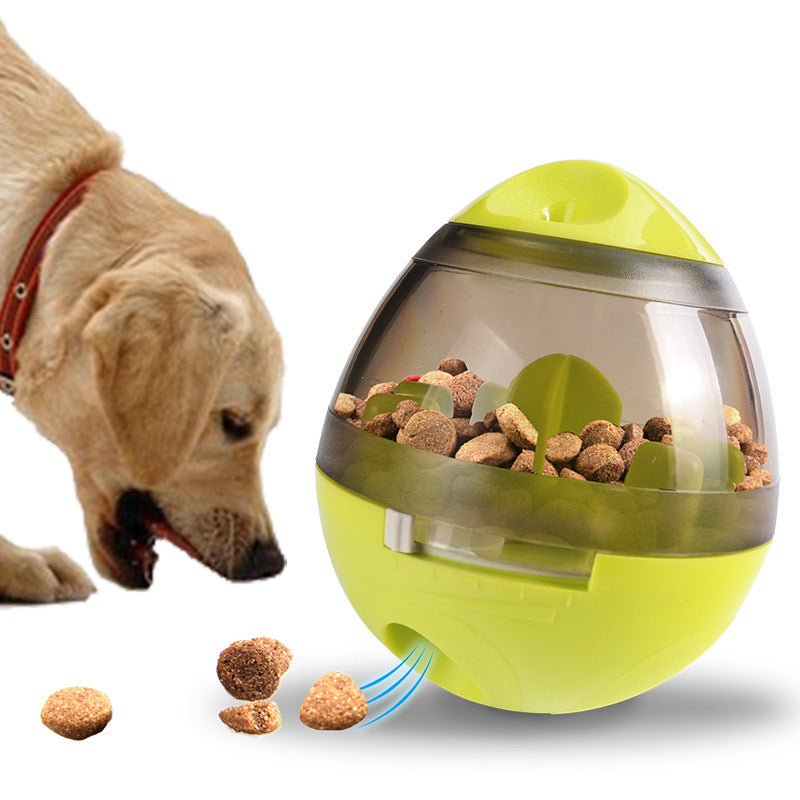yellow interactive pet feeder toy dispensing kibble with a dog eating nearby