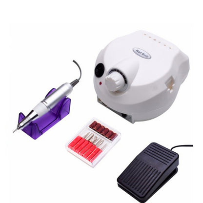 Electric nail drill kit with white control unit, silver handpiece on purple stand, black foot pedal, and nail drill bits