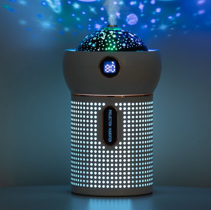 Modern white projection humidifier with star and planet light display in dark room